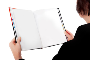 Woman holding open book with blank page