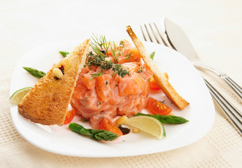 Salmon carpaccio on restaurant table