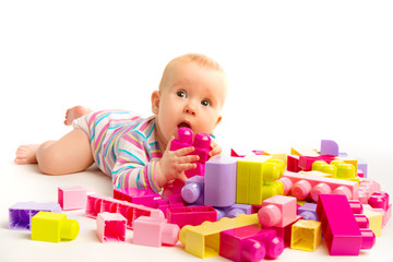 baby playing in designer toy blocks