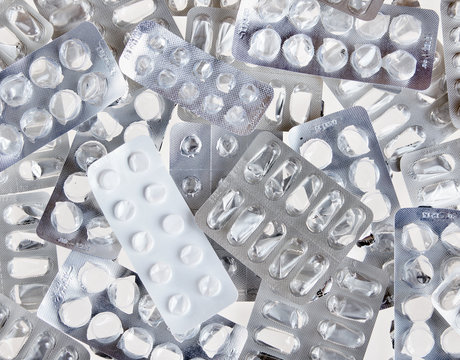 Background made of empty used packs of pills