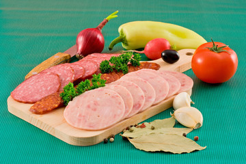 Salami and sausage slices and vegetables