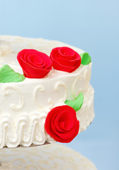 Red rose marzipan decoration on wedding cake
