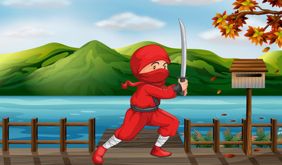 A red ninja beside the wooden mailbox © GraphicsRF