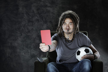 Football fan watching television
