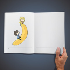 Kids playing with a banana inside a book  