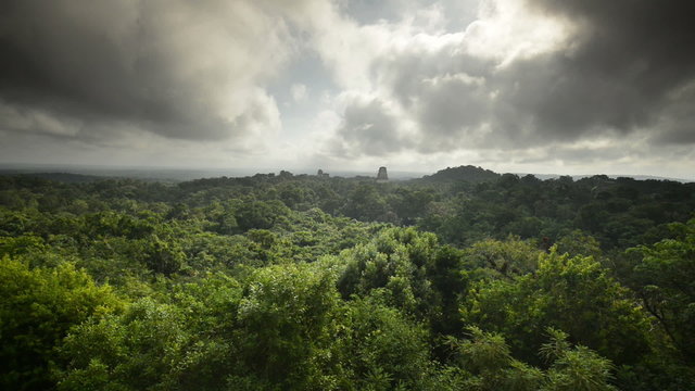Clouds sweep over the major pyramids of Tikal, time lapse