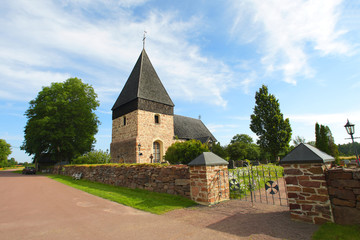 Country church with wooden shingle roof in Aland Islands.