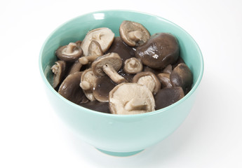 pickled mushrooms in the ceramic bowl