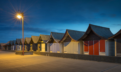 Beach Huts at Night at Mablethorpe, Lincolnshire, UK.