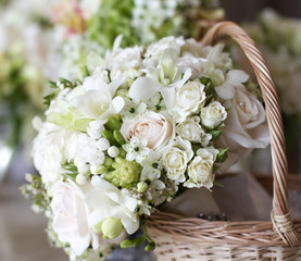 Beautiful white wedding bouquets in basket