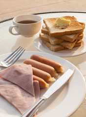 breakfast with fried eggs, butter toasts and coffee