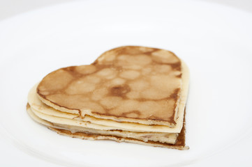 heart-shaped pancakes on white