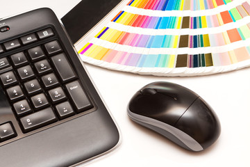 color swatches and computer keyboard, mouse