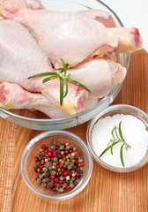 raw chicken legs and spices