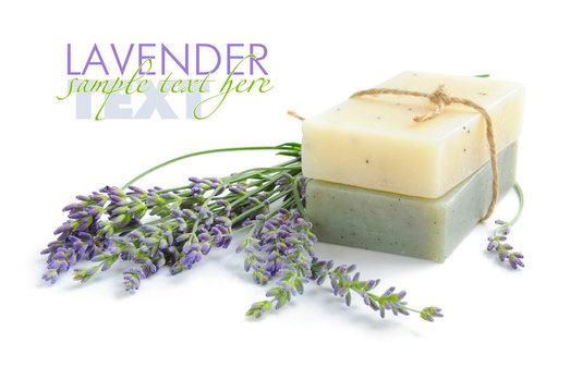 Handmade soap and lavender flowers on a white background