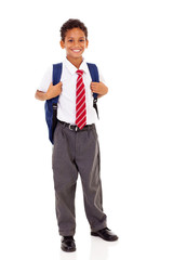 male elementary school student with backpack isolated on white