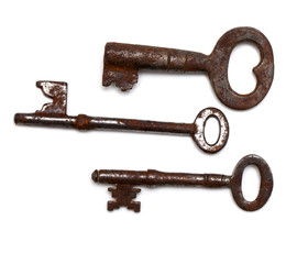 three old keys isolated on white background