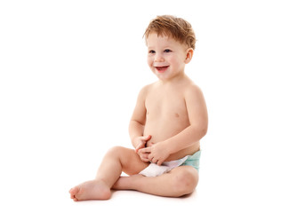 Smiling baby sitting on the floor