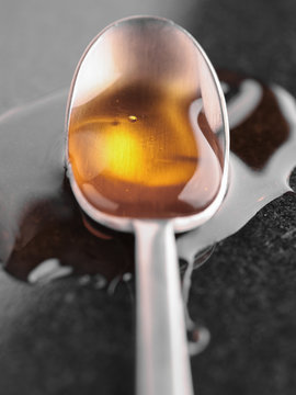 Tablespoon with golden syrup
