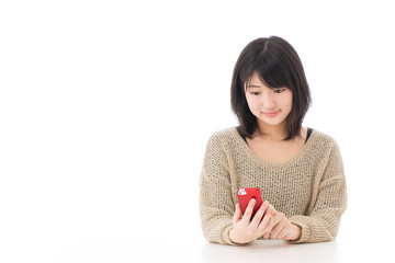 a young asian woman using smart phone