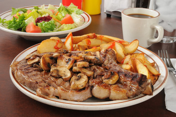 Grilled rib steak with sauteed mushrooms