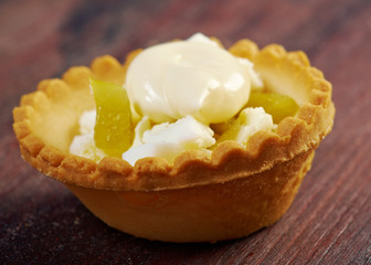 tartlet with salad on wooden board