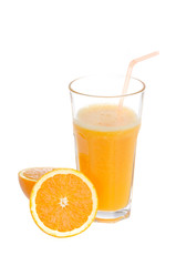 glass of orange juice and oranges isolated