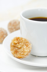 Homemade candy made of almonds, ginger and dates