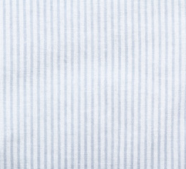 White striped fabric texture. Clothes background. Close up