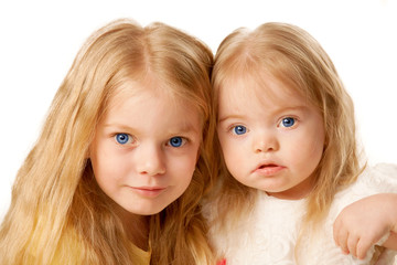 Two lovely sisters. Preschooler and baby girl.