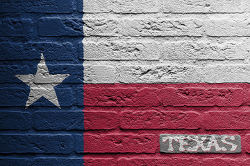 Brick wall with a painting of a flag, Texas