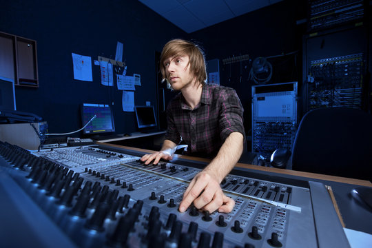 Man using a Sound Mixing Desk