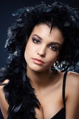 Fototapeta premium Attractive woman with black feather boa