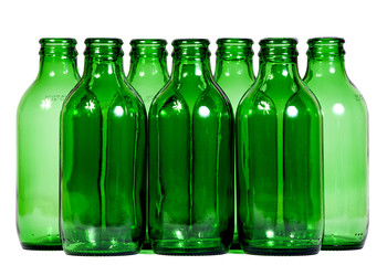 Green glass bottles against white