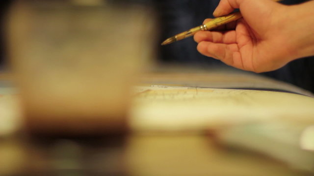Watercolor painter - hand that paints a landscape