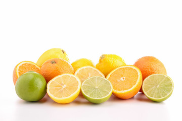 Fototapeta na wymiar heap of orange, green and yellow lemon