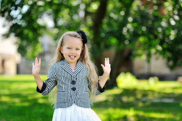 Sweet little girl having fun in a park
