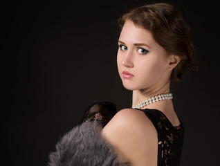 The girl in the retro image of a black background