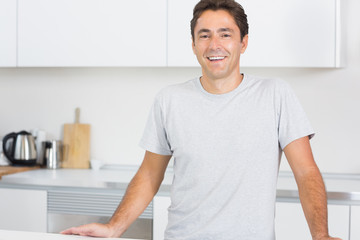 Smiling man in kitchen