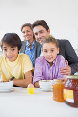 Happy family having breakfast