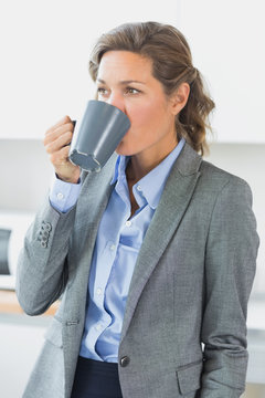 Woman having coffee before work