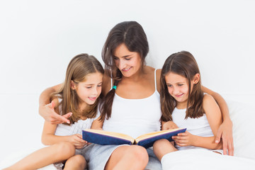 Mother and her children looking at a photo album