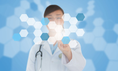 Doctor using touchscreen displaying chemical hologram