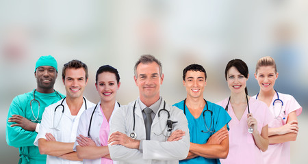Fototapeta premium Medical team standing arms crossed in line