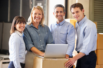 Portrait Of Workers In Distribution Warehouse