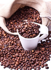 cup of coffee on a background coffee beans 