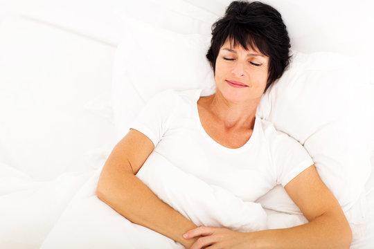 Overhead View Of Elegant Middle Aged Woman Sleeping On Bed