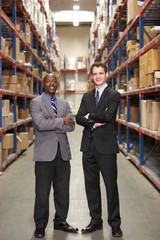 Portrait Of Two Businessmen In Warehouse