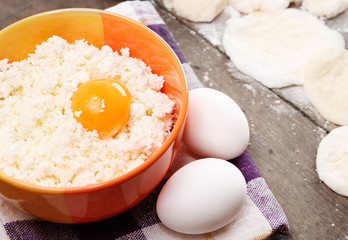 Still life with cheese cottage, eggs and pastry