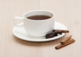 Hot cup of coffee with candy